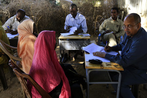 Special Prosecutor for Crimes in Darfur Mohamed and his team talk to women during an investigation into allegations of mass rape in the village of Tabit, in North Darfur