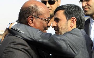iranian_president_mahmoud_ahmadinejad_r_hugs_sudan_s_president_omar_hassan_al-bashir_after_talks_focused_on_boosting_political_and_economic_ties_between_their_countries_at_the_khartoum_international-2-0baef